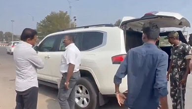 BRS Working Presdent KTR looks on as officials check his vehicle