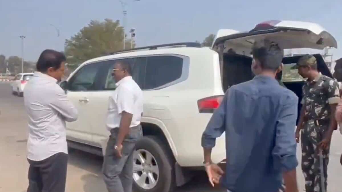 BRS Working Presdent KTR looks on as officials check his vehicle