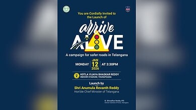 Image shows a dark blue poster that says 'Arrive Alive' in yellow