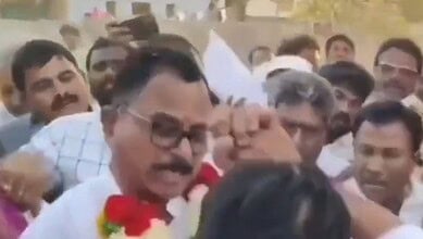 Image shows an altercation between Bharat Rashtra Samithi MLA Vijayudu and Congress MP Mallu Ravi