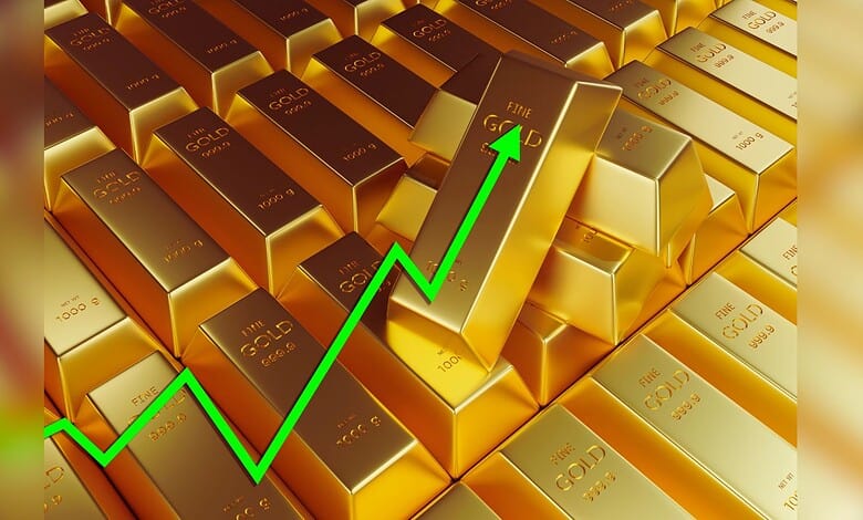 Image shows Stacks of gold bars with a rising green arrow symbolizing an increase in gold prices or market value.