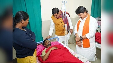 Madhya Pradesh Chief Minister Mohan Yadav and Minister Kailash Vijayvargiya meet an affected person undergoing treatment after consumption of contaminated water, at a hospital in Indore.