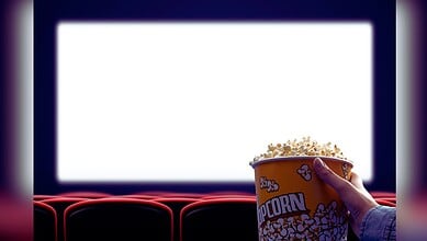 Image showing a theatre screen with a person holding a bucket of popcorn