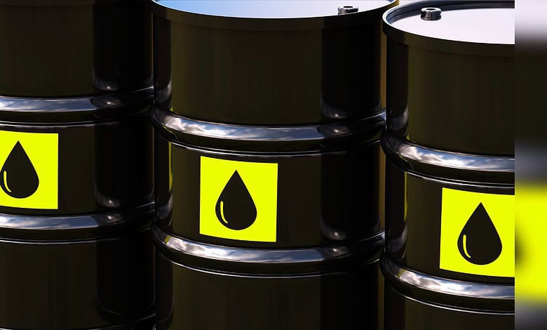Image shows Black oil barrels with yellow labels featuring a droplet icon arranged in a group.