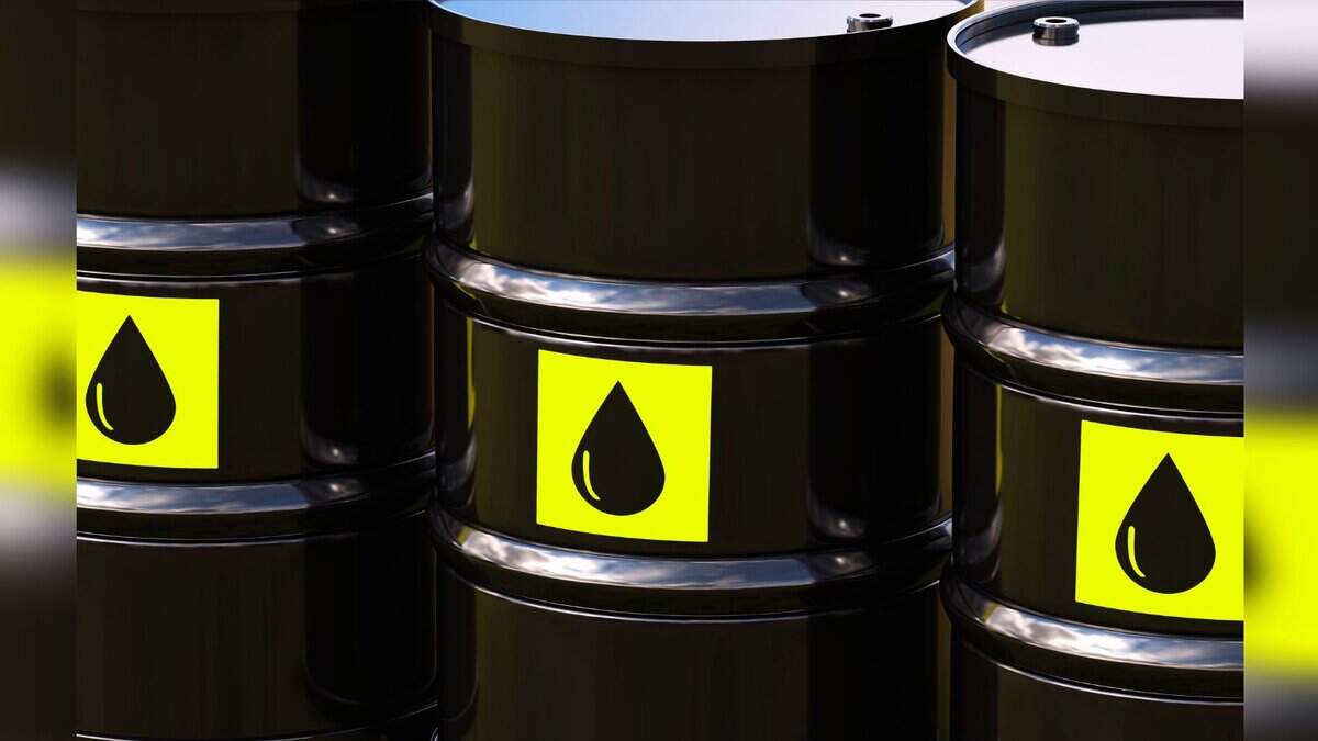 Image shows Black oil barrels with yellow labels featuring a droplet icon arranged in a group.