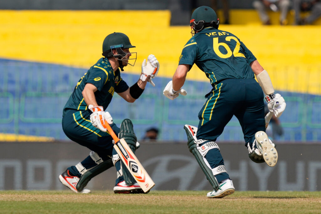 Australian cricket players celebrating during a match.