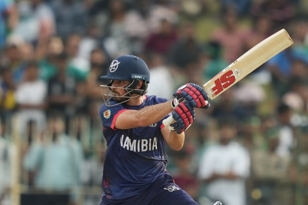 Cricket player from Namibia batting during T20 World Cup match.