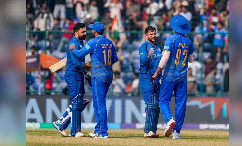 Afghanistan's Azmatullah Omarzai and Mohammad Nabi celebrate the win during the ICC Men's T20 World Cup 2026 cricket match between Afghanistan and UAE in New Delhi on Monday, February 16.