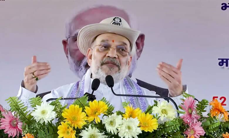 Amit Shah speaking at a political rally in West Bengal, emphasizing BJP's victory and anti-infiltration s.