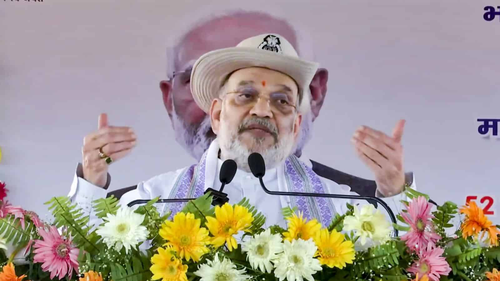 Amit Shah speaking at a political rally in West Bengal, emphasizing BJP's victory and anti-infiltration s.