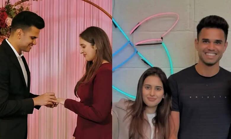 Wedding couple exchanging rings at a celebration event.