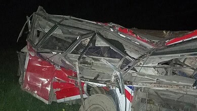 A bus is mangled after falling from a hill in Nepal