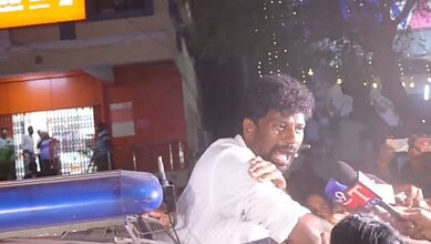 BRS leader Balka Suman being detained after attacking Congress minister's convoy.