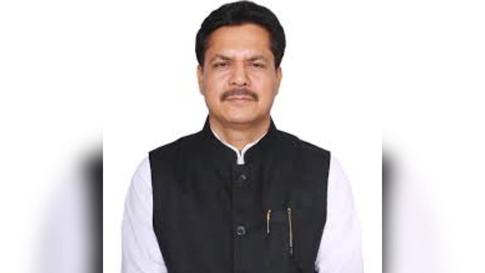 Political leader speaking at a public event in India.