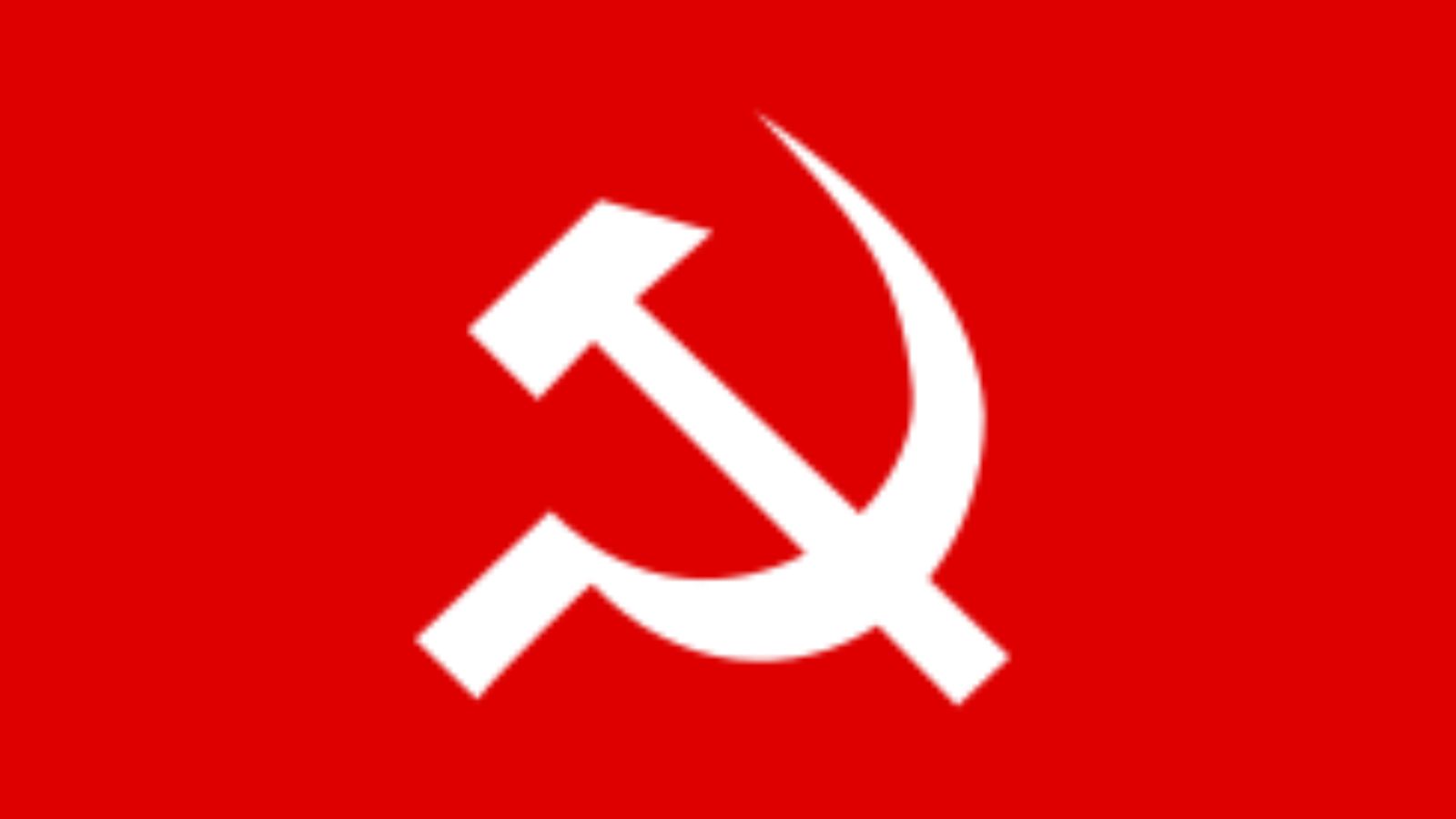 Protesters holding flags and banners during a political rally in India.