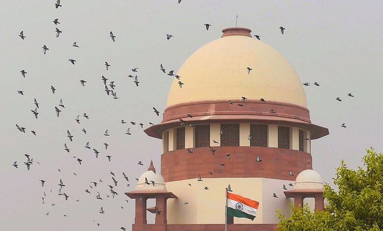 Indian Supreme Court building with flying birds, symbolising justice and freedom.