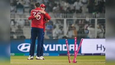 England's Jamie Overton celebrates with teammate after taking Italy's last wicket during the 2026 ICC Men's T20 World Cup cricket match between England and Italy at the Eden Gardens in Kolkata on Monday, February 16.