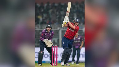 England cricket player batting during a match against Scotland in the T20 World Cup.