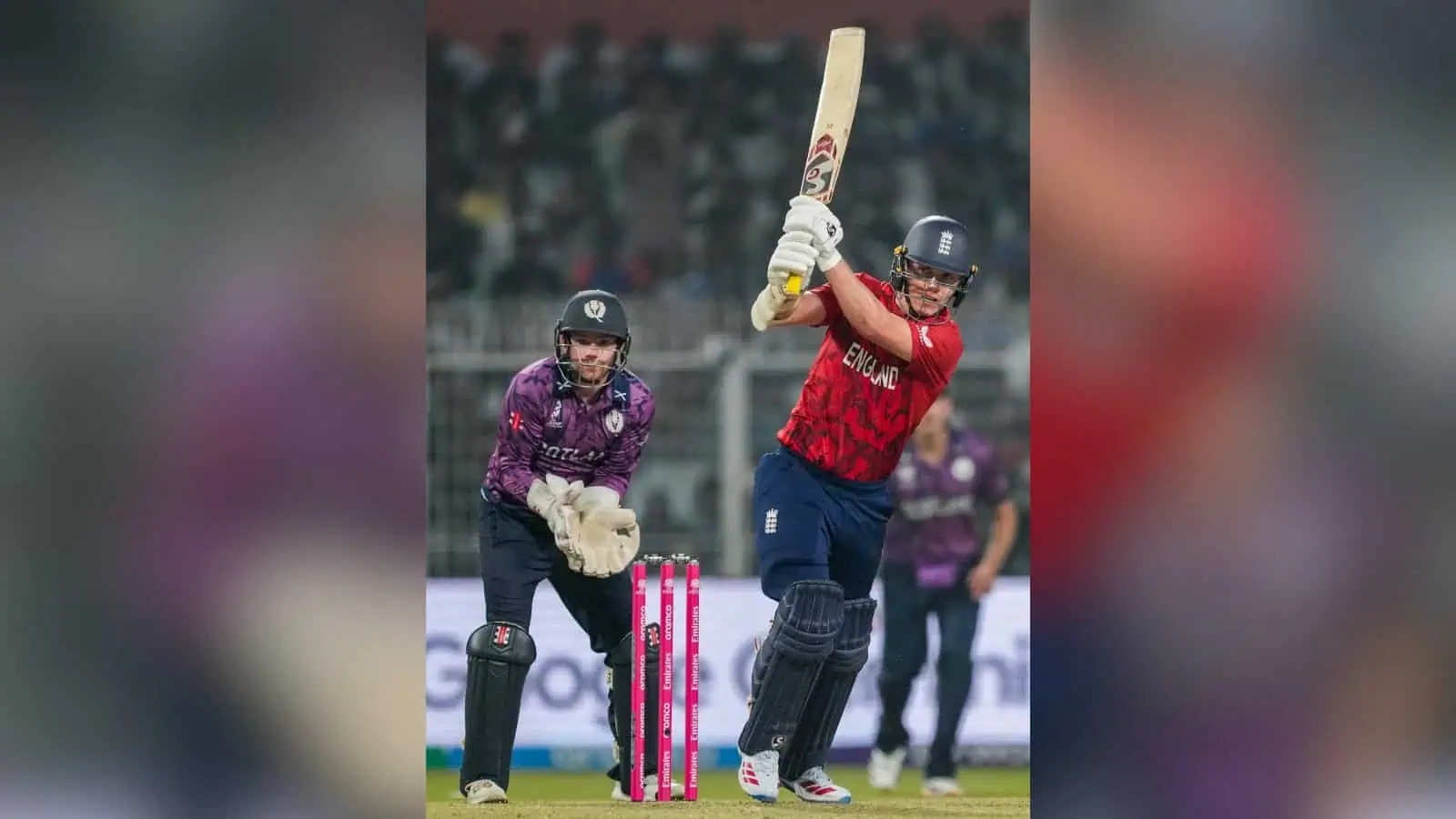 England cricket player batting during a match against Scotland in the T20 World Cup.