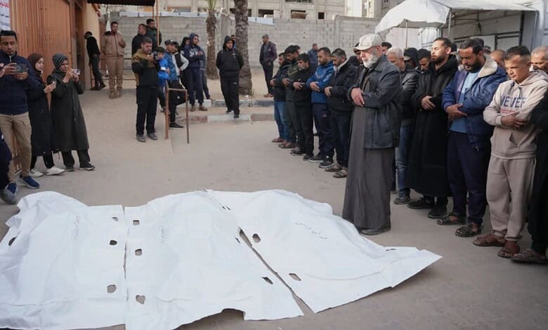 Palestinians mourn over the bodies of men who were killed in an Israeli military strike, during their funeral at Nasser hospital in Khan Younis, Feb 4, 2026.