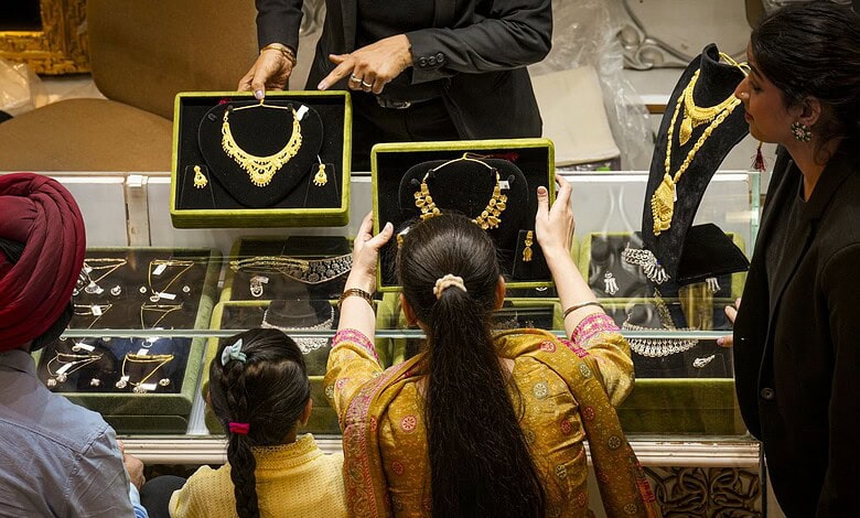 Customers at a jewellery shop on the occasion of the Dhanteras festival, in New Delhi, Saturday, Oct. 18, 2025.