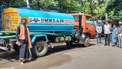 Image shows an HMWSSB tanker truck parked on the street