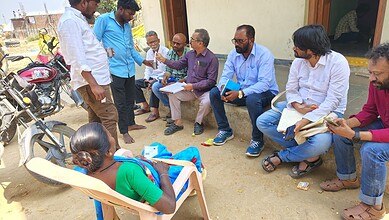 People engaged in a health forum addressing kidney health issues.