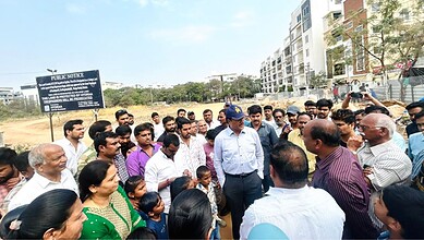 Group of officials and locals discussing the new government college project in Kondapur.