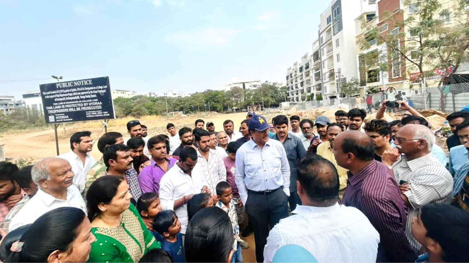Group of officials and locals discussing the new government college project in Kondapur.