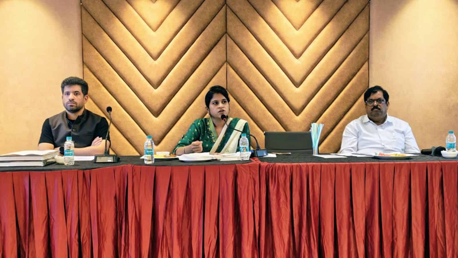 Telangana medical tourism conference with healthcare professionals discussing medical travel options.