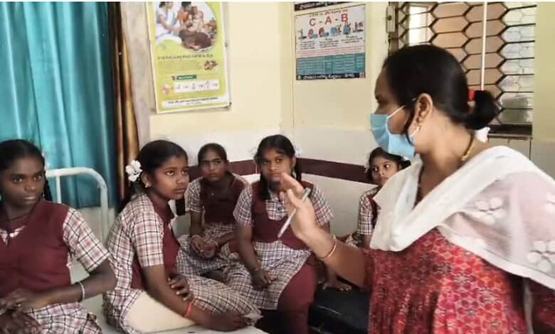 School girls in Telangana after food poisoning incident with a woman health educator.