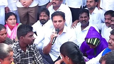 Image shows BRS working president KTR sitting on a dharna