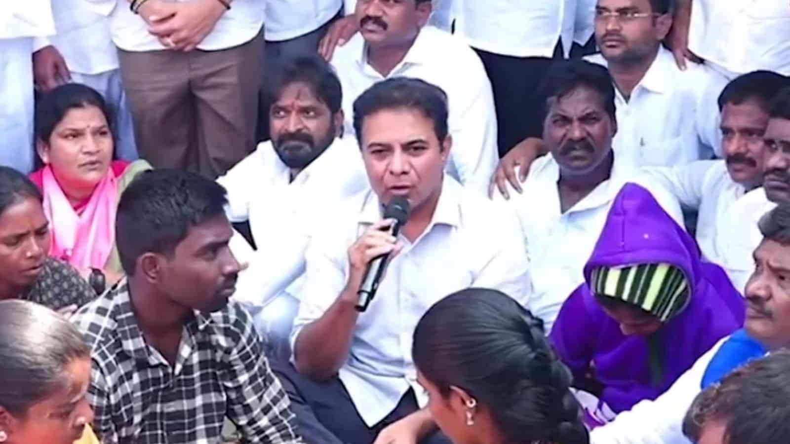Image shows BRS working president KTR sitting on a dharna