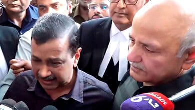 Kejriwal weeping with journalists and supporters after court clears him in excise case.