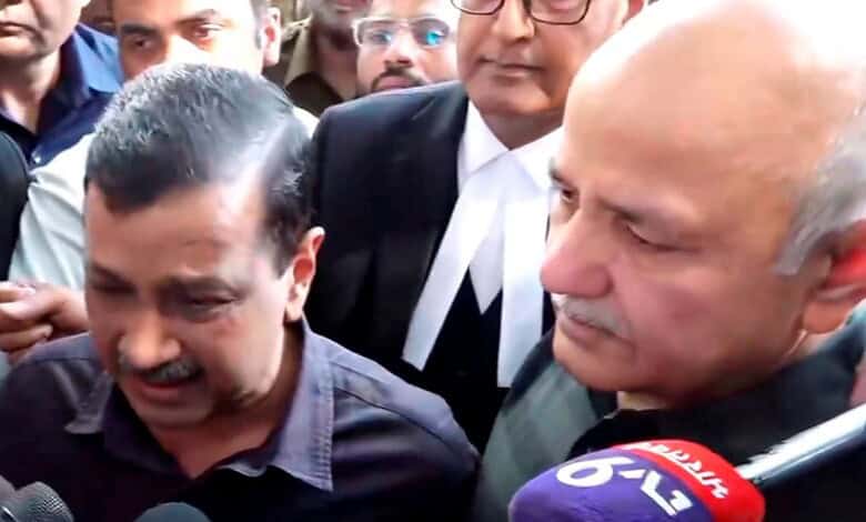 Kejriwal weeping with journalists and supporters after court clears him in excise case.