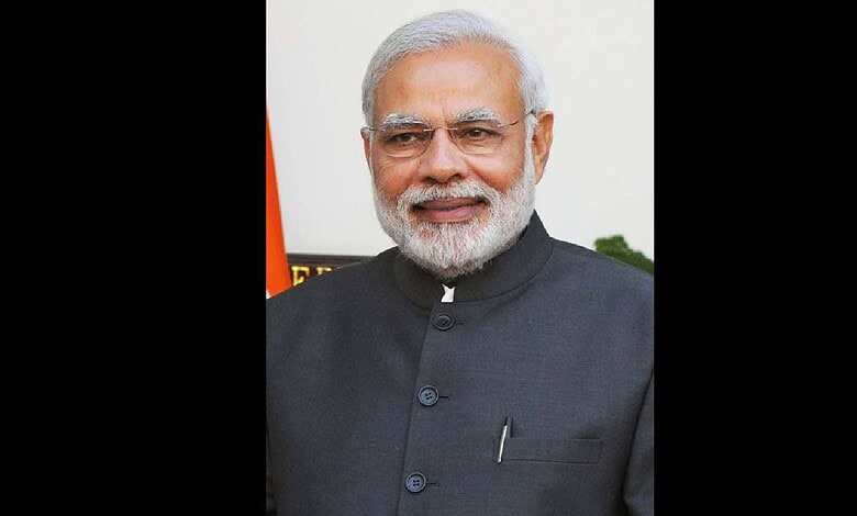 Indian Prime Minister Narendra Modi smiling at the Seva Teerth event.