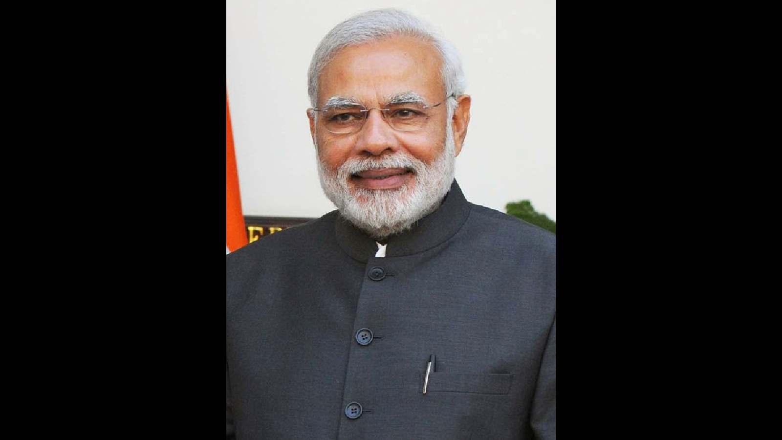 Indian Prime Minister Narendra Modi smiling at the Seva Teerth event.