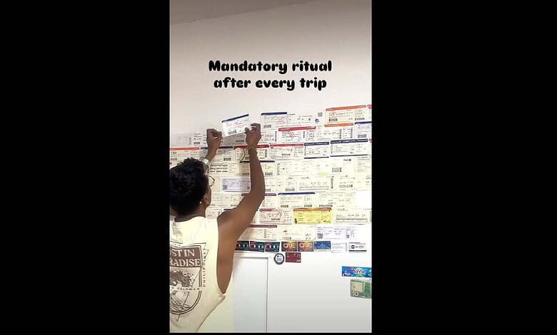 Man posts flight tickets on the wall in his room