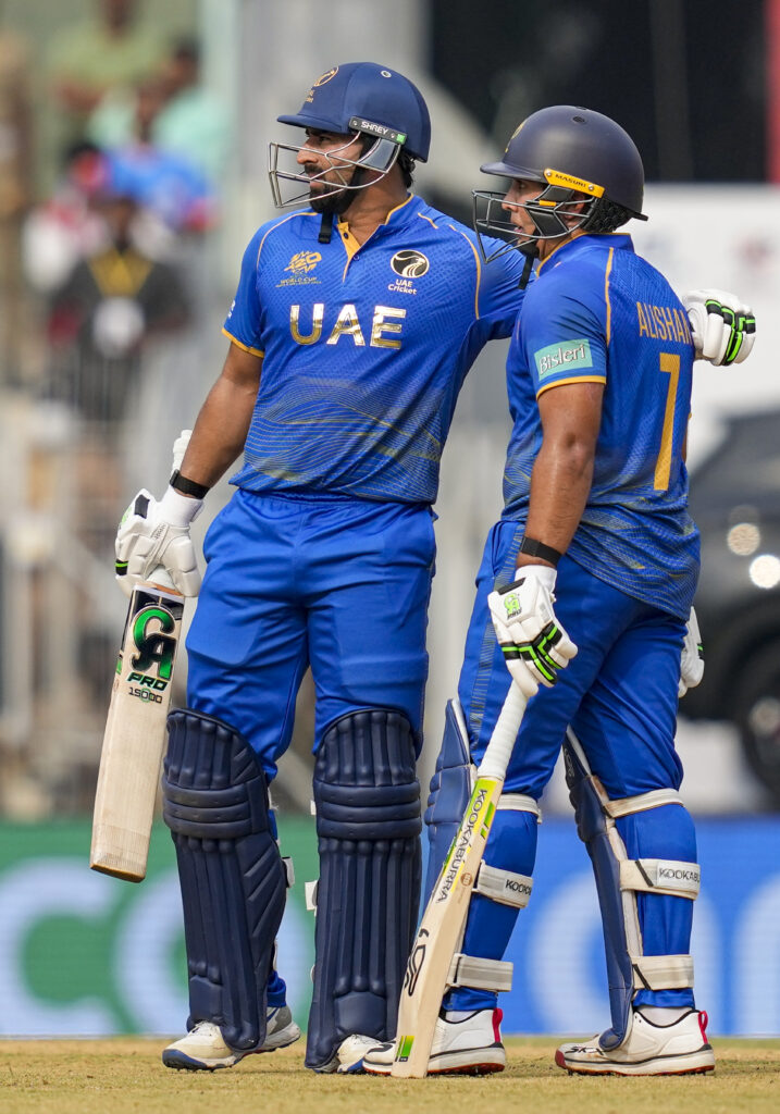 UAE cricket players celebrating during a match at the T20 World Cup.