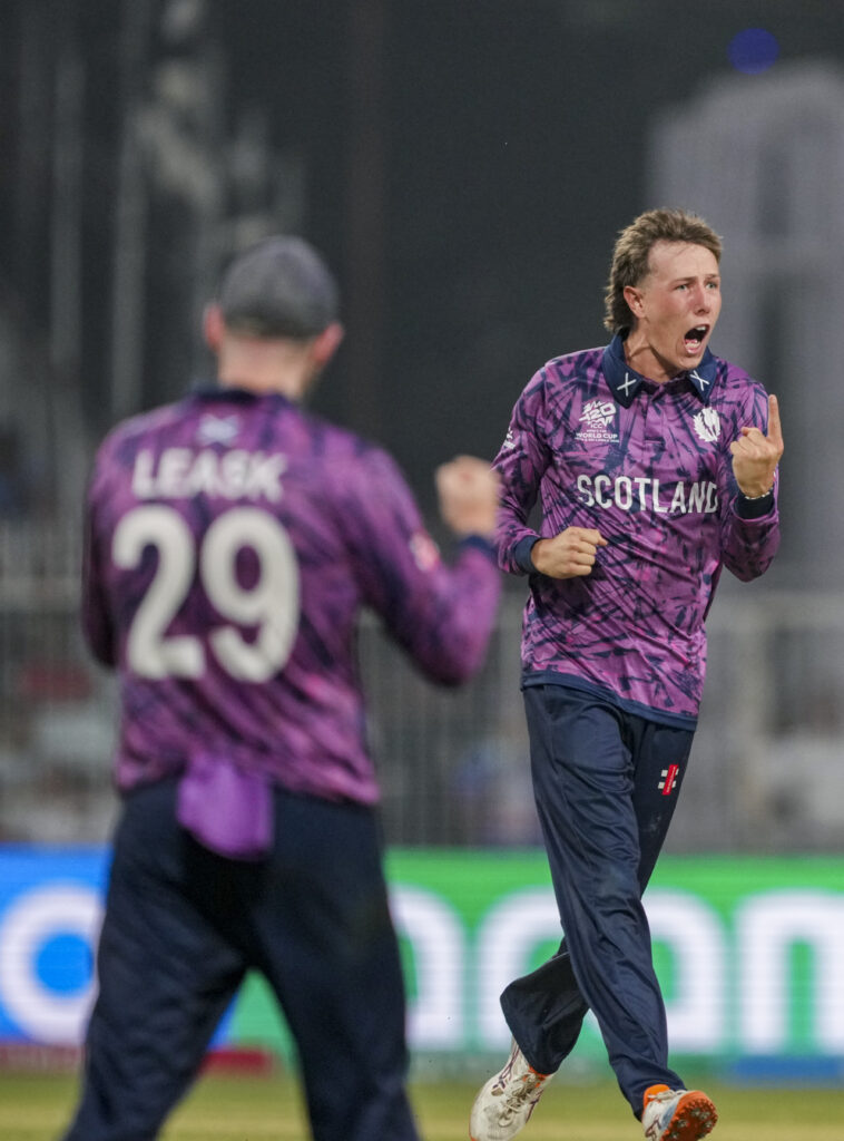 England cricket player celebrating a wicket during T20 World Cup match.
