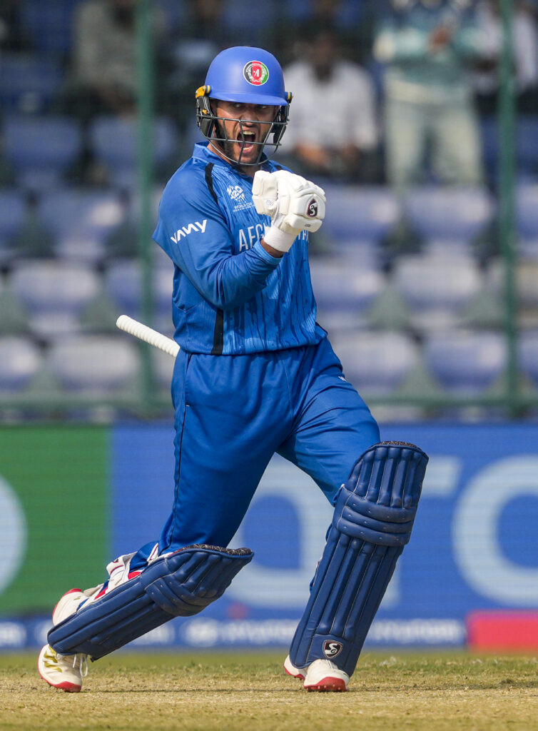 Omarzai in cricket gear celebrating a key wicket during Afghanistan's match against UAE.
