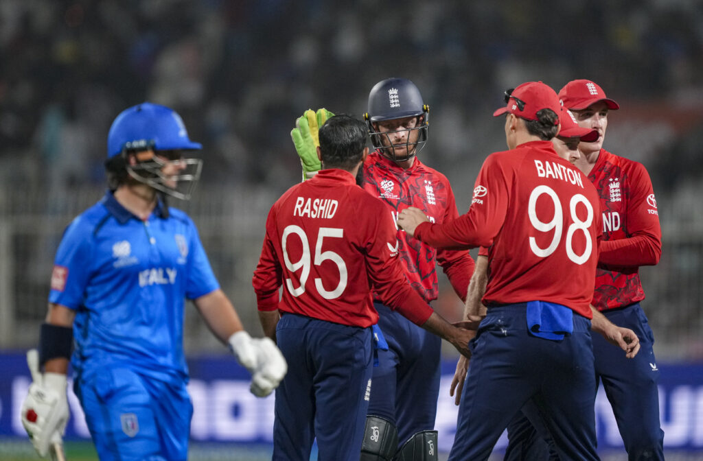 England cricket team celebrating during a T20 World Cup match.