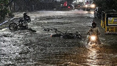 Street flooded with rainwater in Hyderabad amid unseasonal weather and hailstorms.