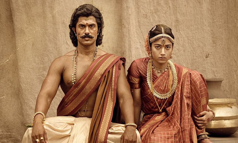 Actors in traditional Indian wedding attire, portraying a scene from a historical or cultural film.
