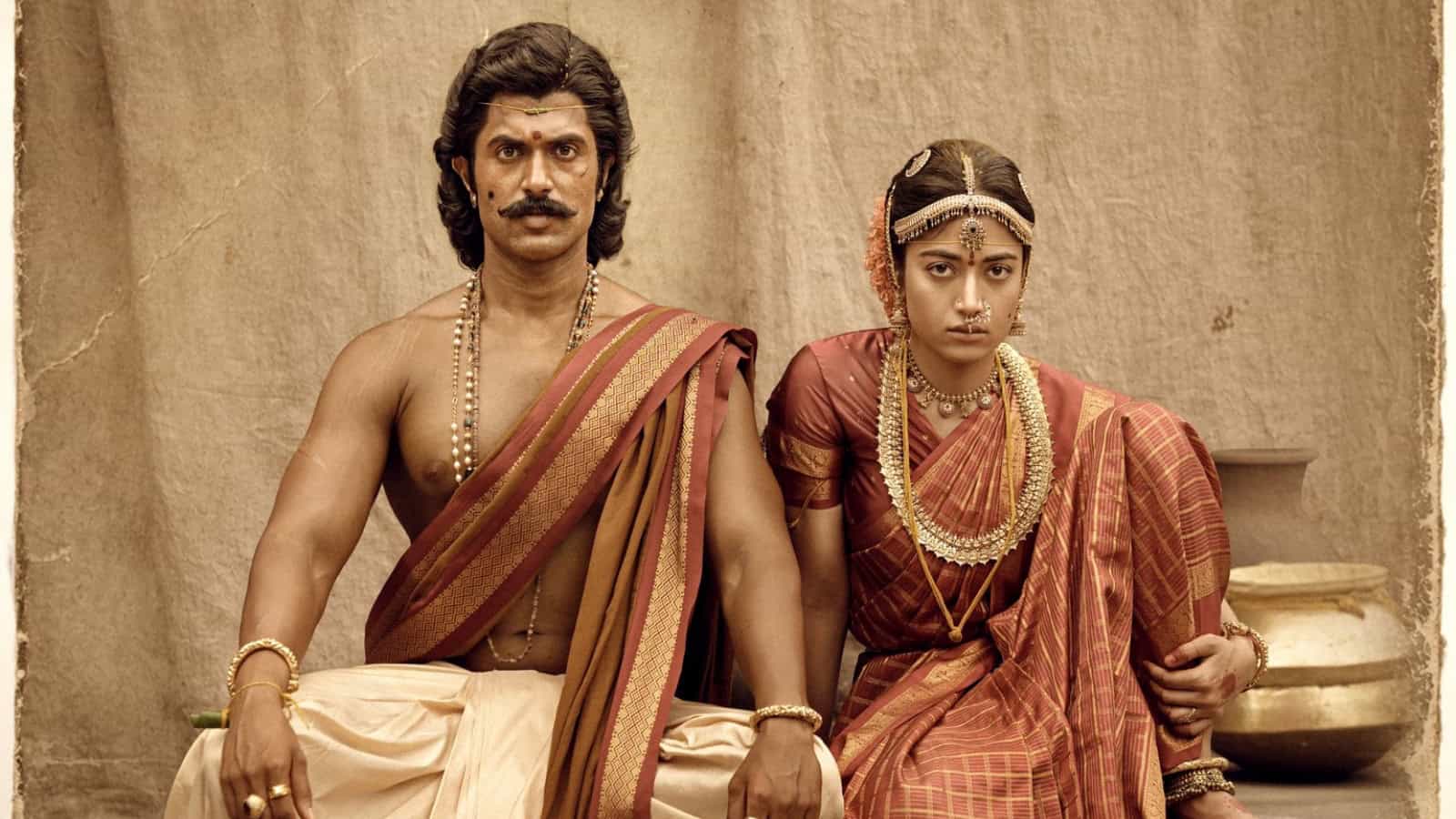 Actors in traditional Indian wedding attire, portraying a scene from a historical or cultural film.