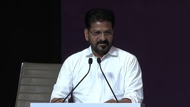 Revanth Reddy delivering a keynote speech at the AI Summit Delhi, focusing on technology and innovation.