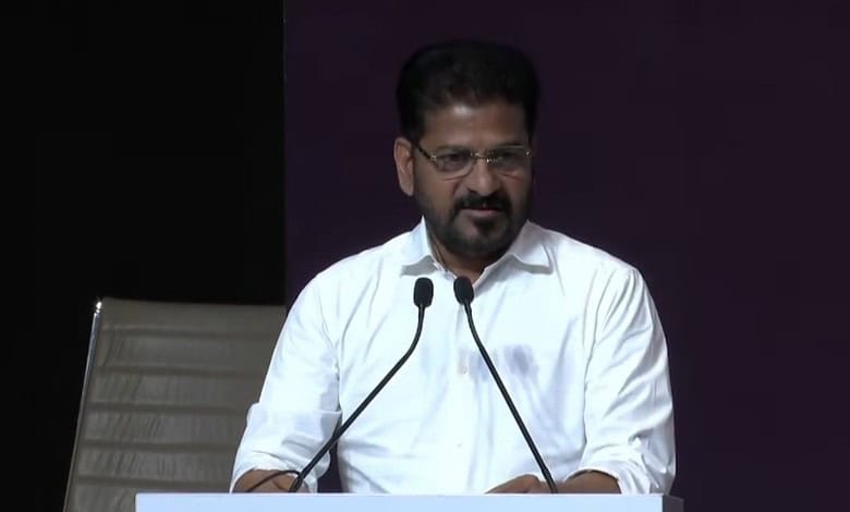 Revanth Reddy delivering a keynote speech at the AI Summit Delhi, focusing on technology and innovation.