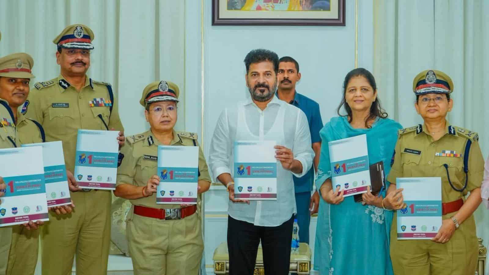 The image shows Telangana CM A Revanth Reddy releasing a book on the 1st Telangana Conference for Women in Police, and the RBVRR TGPA Annual Magazine–2025 at the Secretariat on Friday, February 27, 2026.