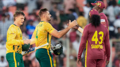 South Africa's captain Aiden Markram, centre, and Ryan Rickelton, left, being greeted by West Indies' players after South Africa won the ICC Men's T20 World Cup 2026 cricket match against West Ind