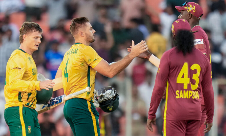 South Africa's captain Aiden Markram, centre, and Ryan Rickelton, left, being greeted by West Indies' players after South Africa won the ICC Men's T20 World Cup 2026 cricket match against West Ind